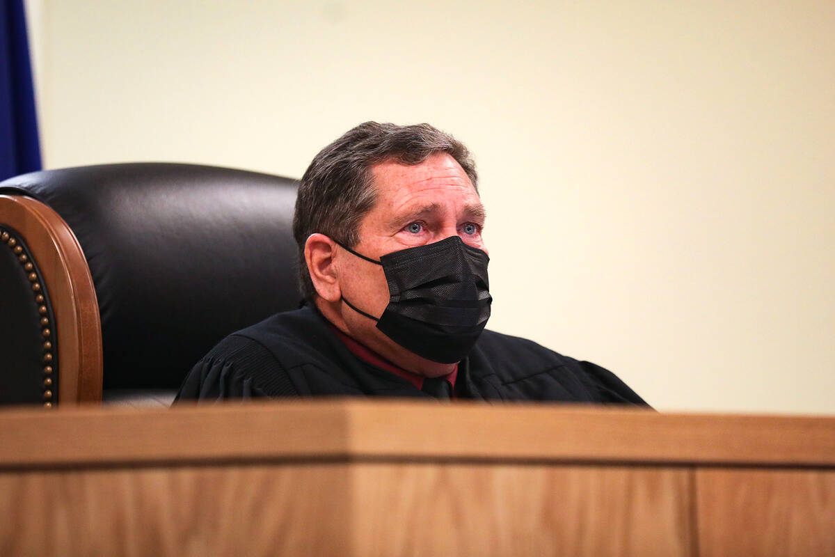 Pahrump Justice of the Peace Kent Jasperson listens to the prosecution speak at a preliminary h ...