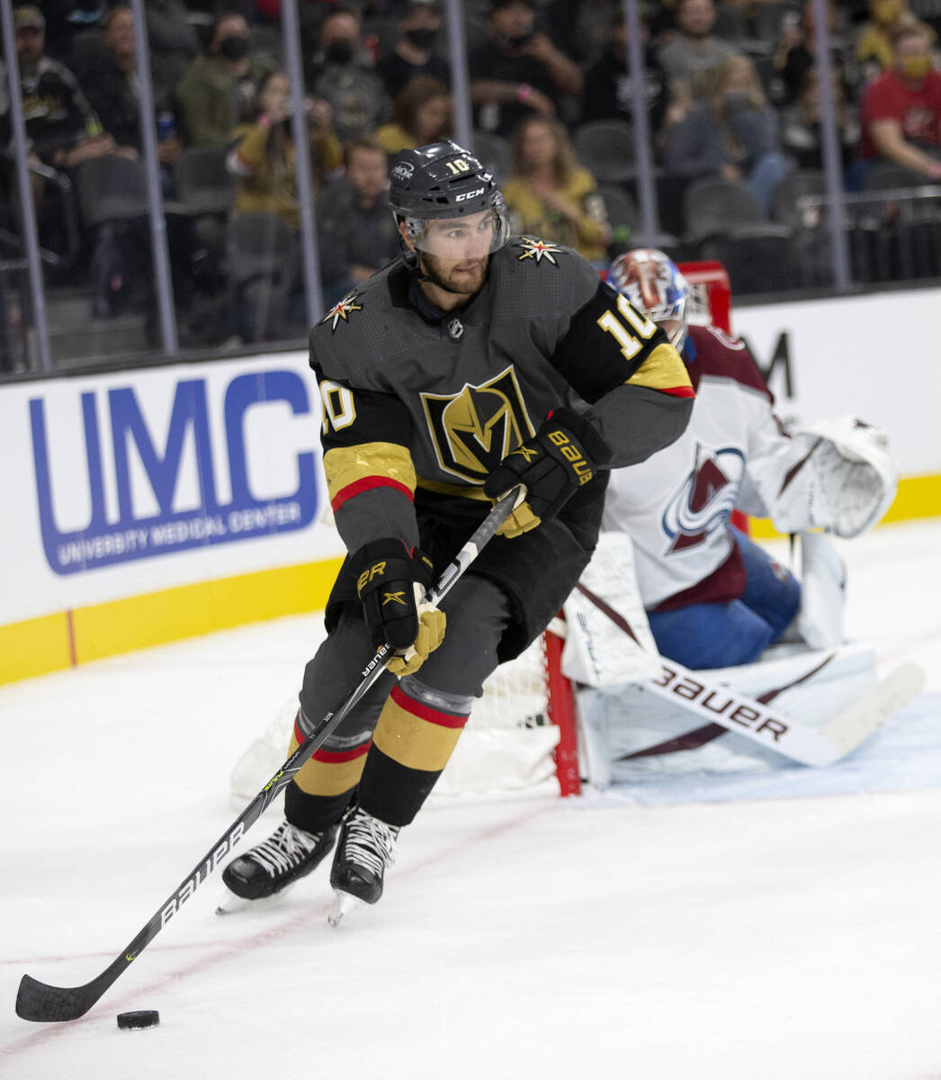 Golden Knights right wing Reilly Smith (19) skates around Avalanche goaltender Jonas Johansson ...