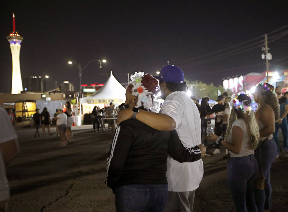 People gather at Art Square before a moment of silence, Friday, Oct. 1, 2021, during First Frid ...