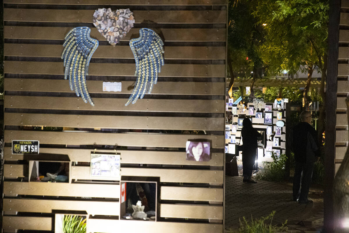 People participate during a ceremony honoring the victims from 1 October at the Las Vegas Heali ...
