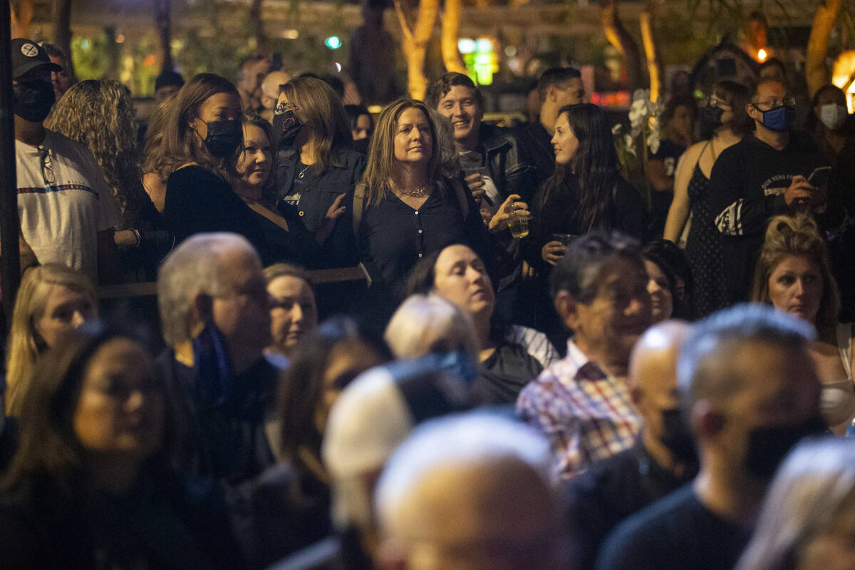 People participate during a ceremony honoring the victims from 1 October at the Las Vegas Heali ...