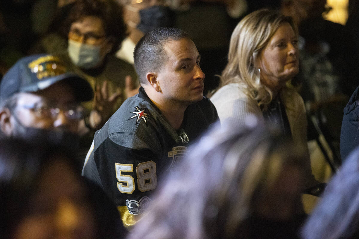 People participate during a ceremony honoring the victims from 1 October at the Las Vegas Heali ...