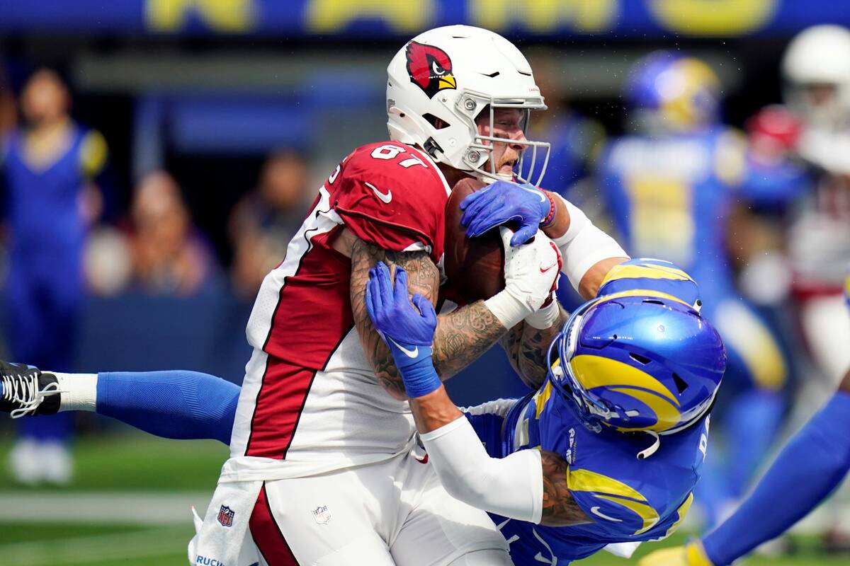 Arizona Cardinals tight end Maxx Williams, left, catches a touchdown next to Los Angeles Rams s ...
