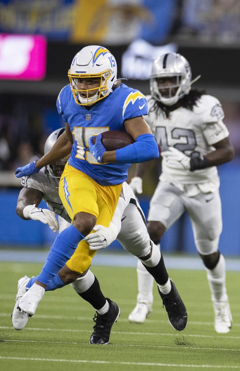 Los Angeles Chargers wide receiver Jalen Guyton (15) sprints up field past Raiders inside lineb ...