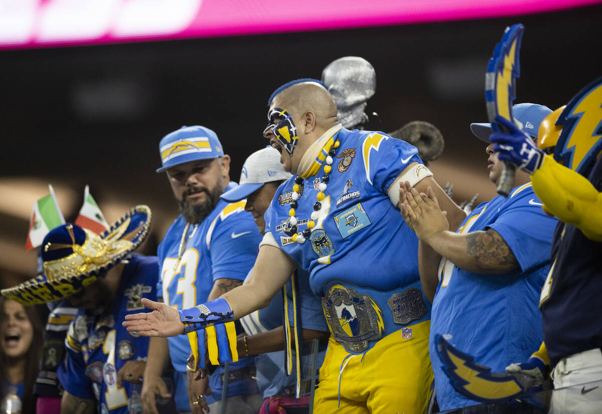 Los Angeles fans cheer for the Chargers in the first half during an NFL football game against t ...