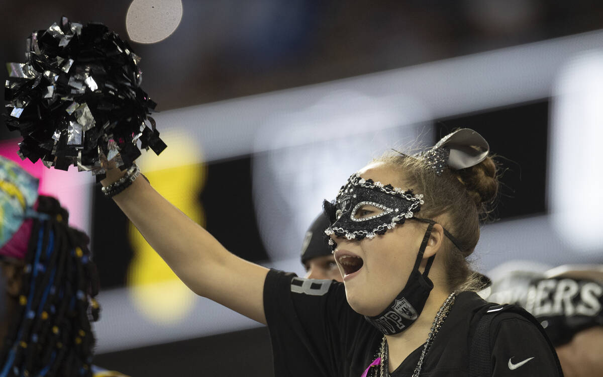 Las Vegas fans cheer for the Raiders in the first half during an NFL football game against the ...