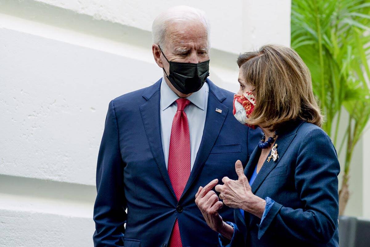 President Joe Biden and House Speaker Nancy Pelosi of Calif., speak together as they depart aft ...