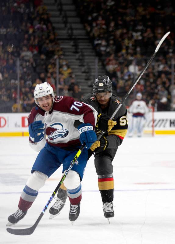 Avalanche right wing Nick Henry (70) and Golden Knights right wing Keegan Kolesar (55) collide ...