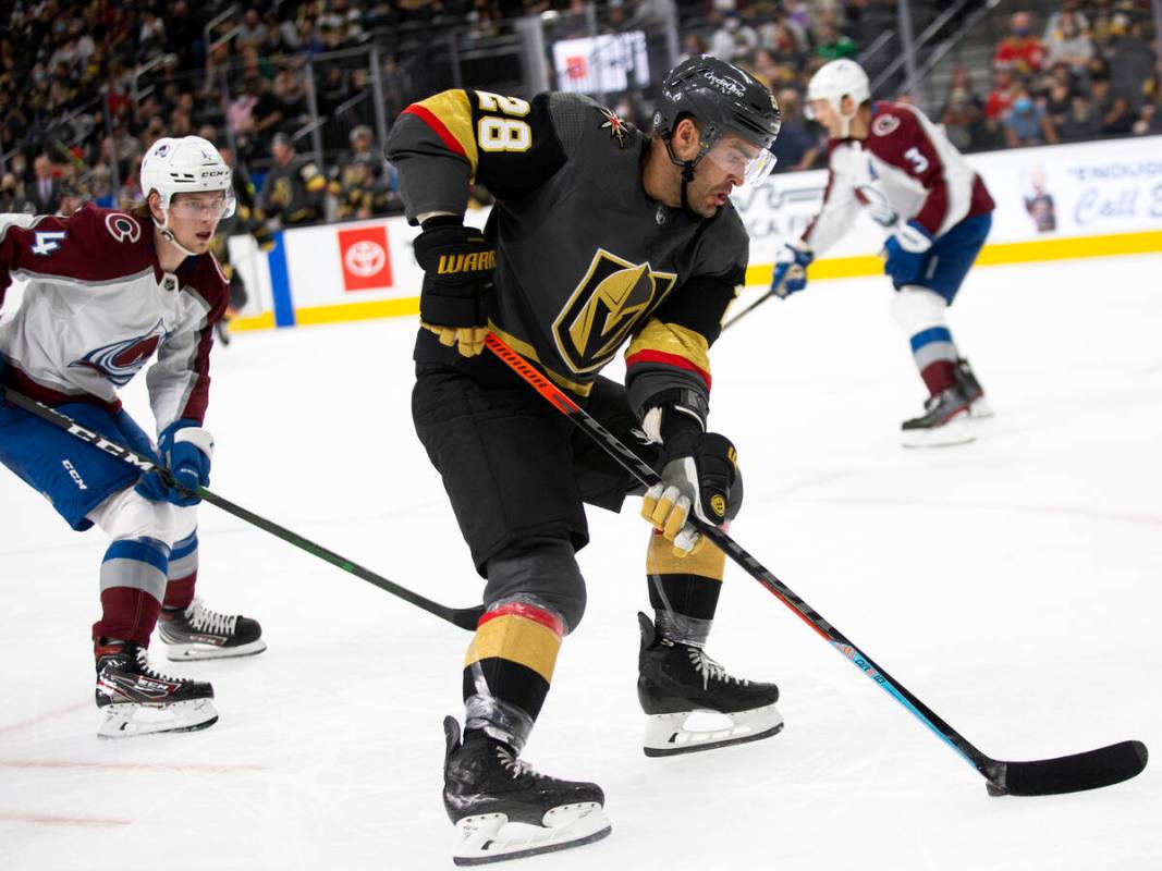 Golden Knights left wing William Carrier (28) gains control of the puck followed by Avalanche d ...