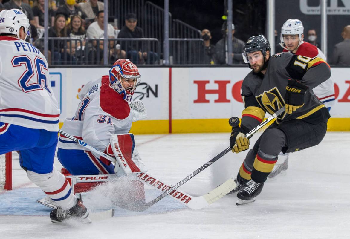 Golden Knights center Nicolas Roy (10) has a shot rejected by Montreal Canadiens goaltender Car ...
