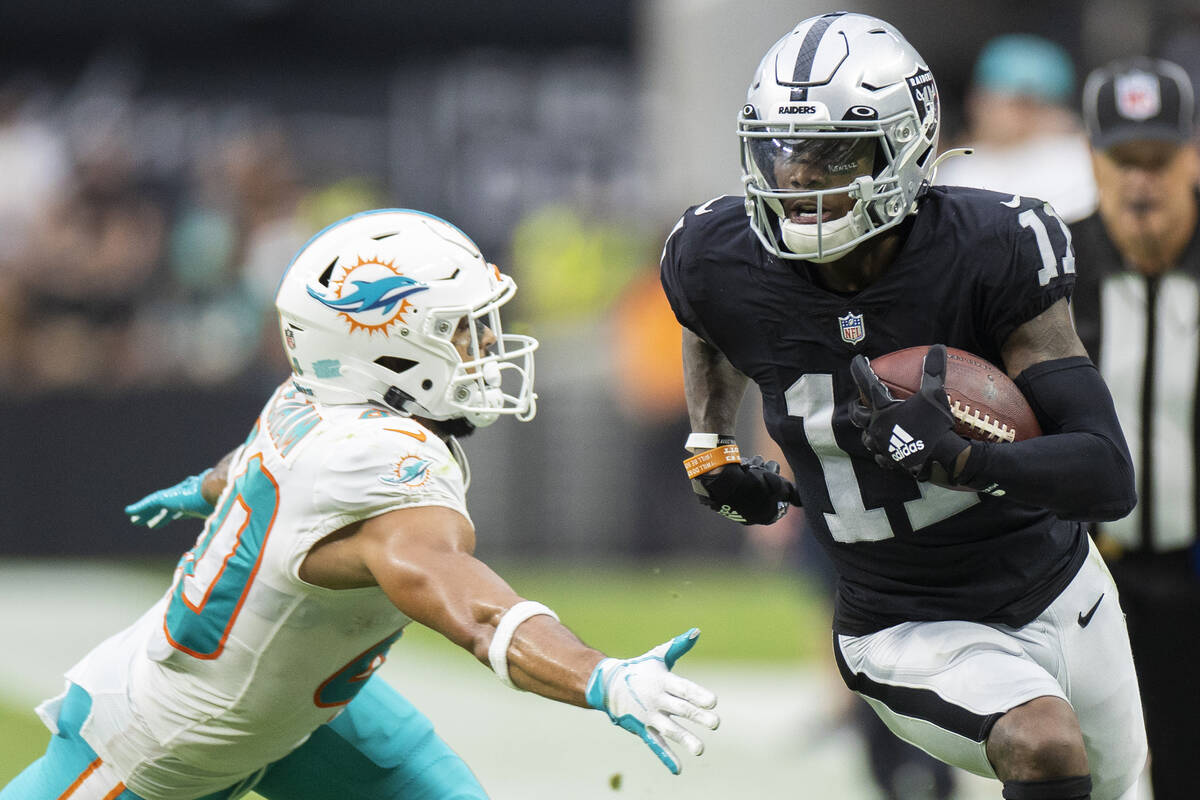 Las Vegas Raiders wide receiver Henry Ruggs III (11) breaks down the sideline past Miami Dolphi ...