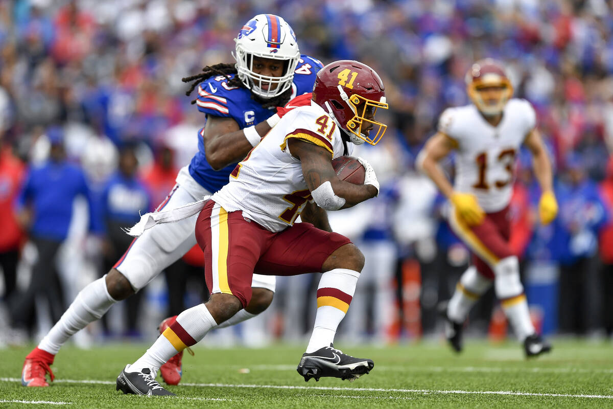 Washington Football Team running back J.D. McKissic (41) carries the ball while pursued by Buff ...