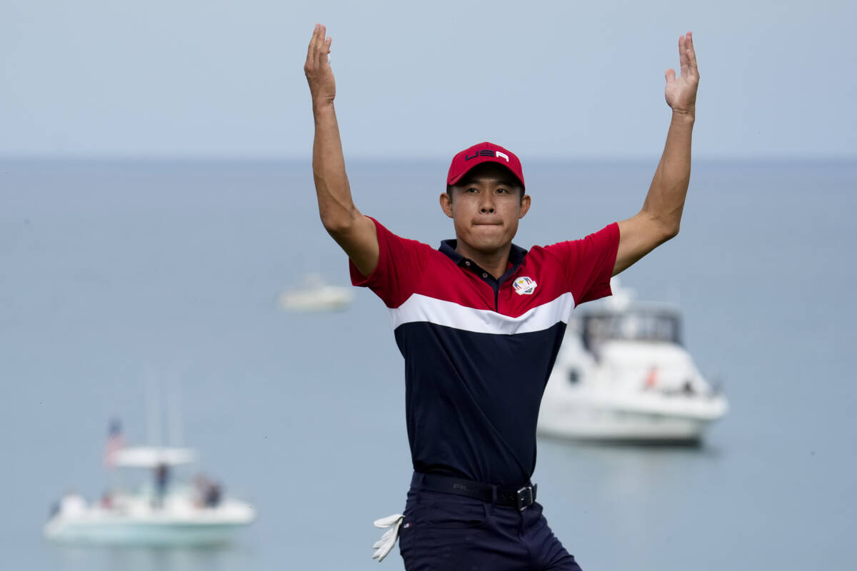 Team USA's Collin Morikawa reacts after winning the 17th hole during a Ryder Cup singles match ...