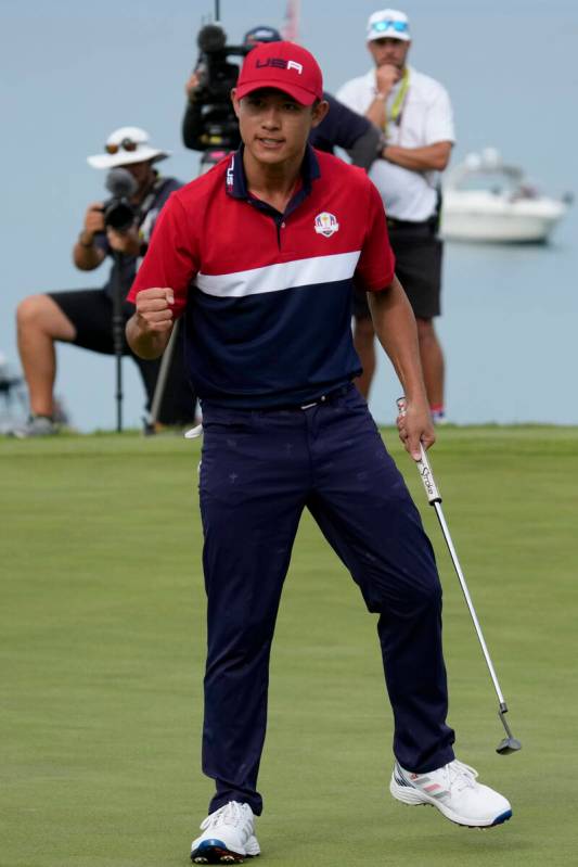 Team USA's Collin Morikawa reacts after winning the 17th hole during a Ryder Cup singles match ...