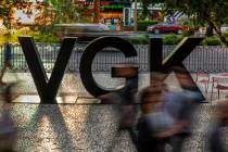 Fans stream by a VGK logo on Las Vegas Blvd. before the start of Game 4 of an NHL Western Confe ...