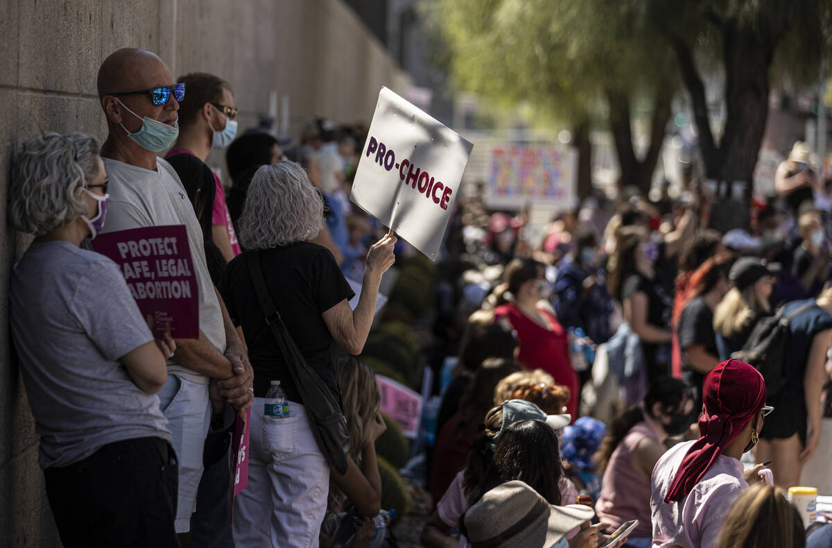 Demonstrators gather outside the Lloyd D George Courthouse during a March for Reproductive Righ ...