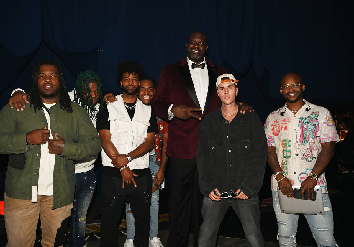 Shaquille O'Neal, Justin Bieber and Beiber's band are shown at "The Event," a benefit concert f ...