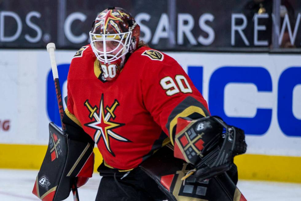 Golden Knights goaltender Robin Lehner (90) stretches for a save prior to the first period of a ...