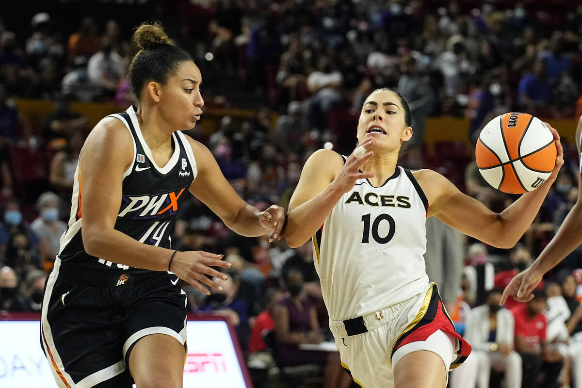 Las Vegas Aces guard Kelsey Plum (10) drives against Phoenix Mercury guard Bria Hartley during ...