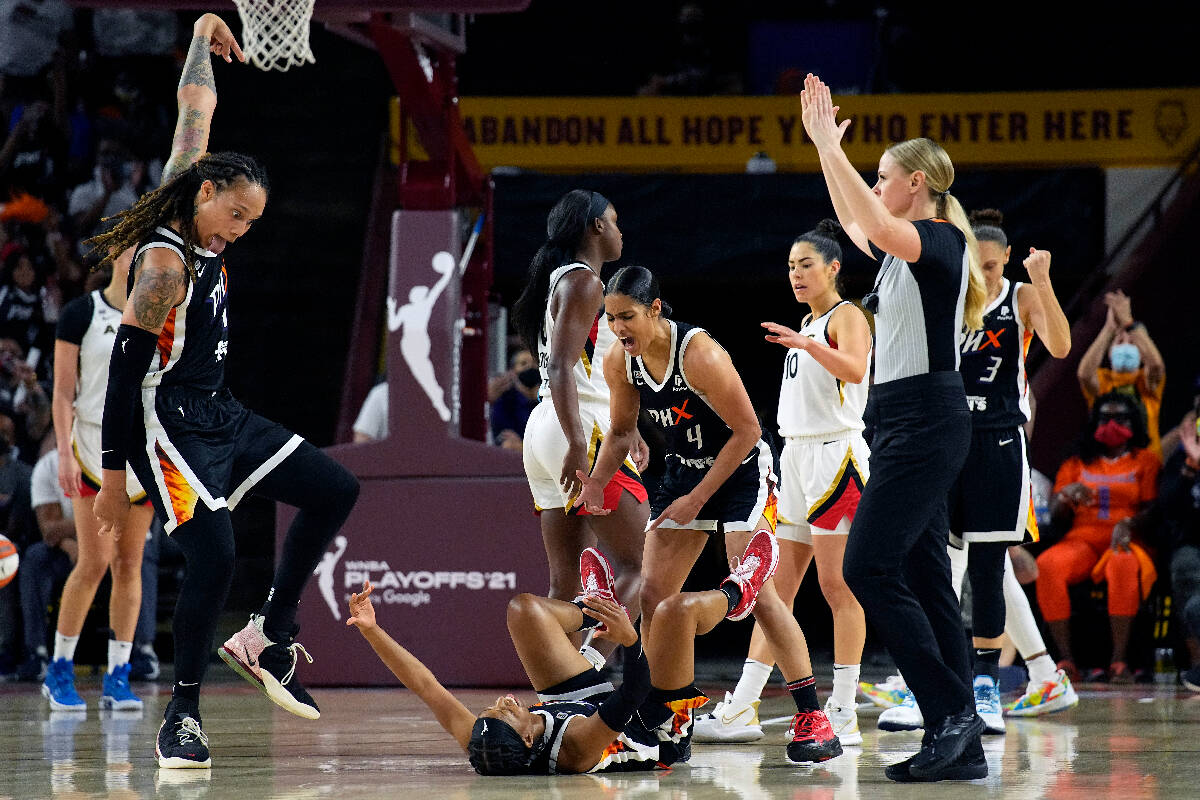 Phoenix Mercury Shey Peddy, bottom, celebrates with Brittney Griner (42), Bria Hartley (14), Ki ...