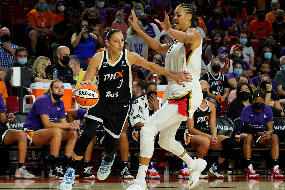 Phoenix Mercury guard Diana Taurasi (3) drives against Las Vegas Aces center Liz Cambage during ...