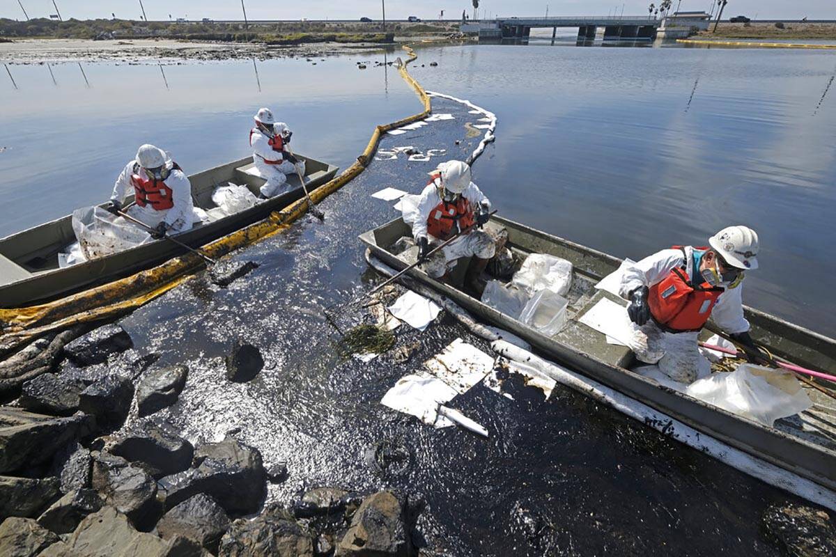 Cleanup contractors deploy skimmers and floating barriers known as booms to try to stop further ...
