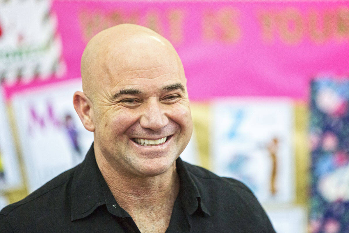 Andre Agassi shares a laugh during an event at Andre Agassi Preparatory Academy in February. ( ...