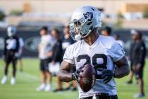 Raiders running back Josh Jacobs (28) with the ball during the Raiders training camp at the Int ...