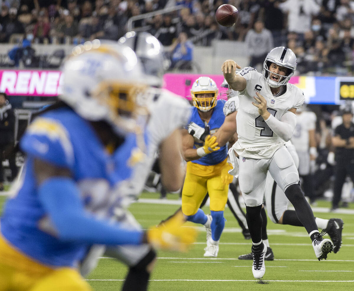 Raiders quarterback Derek Carr (4) makes a pass in the second half during an NFL football game ...