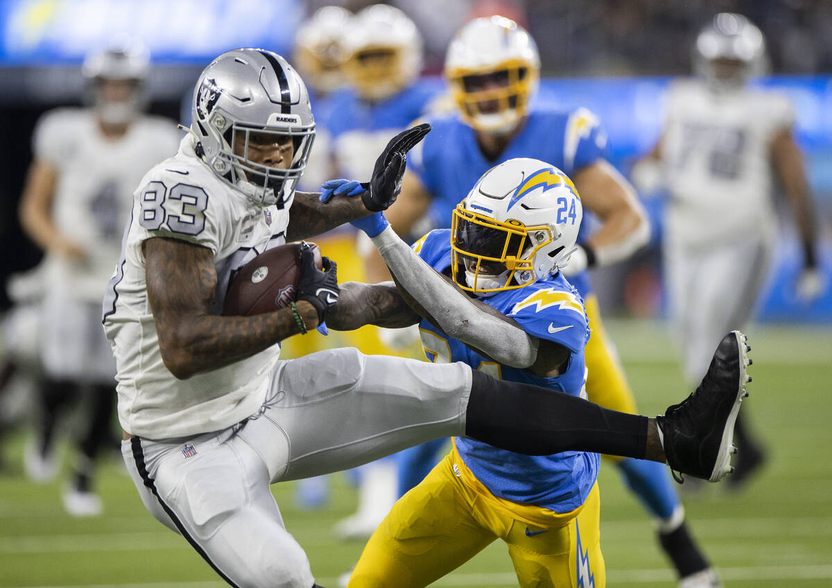 Raiders tight end Darren Waller (83) makes a catch against Los Angeles Chargers defensive back ...