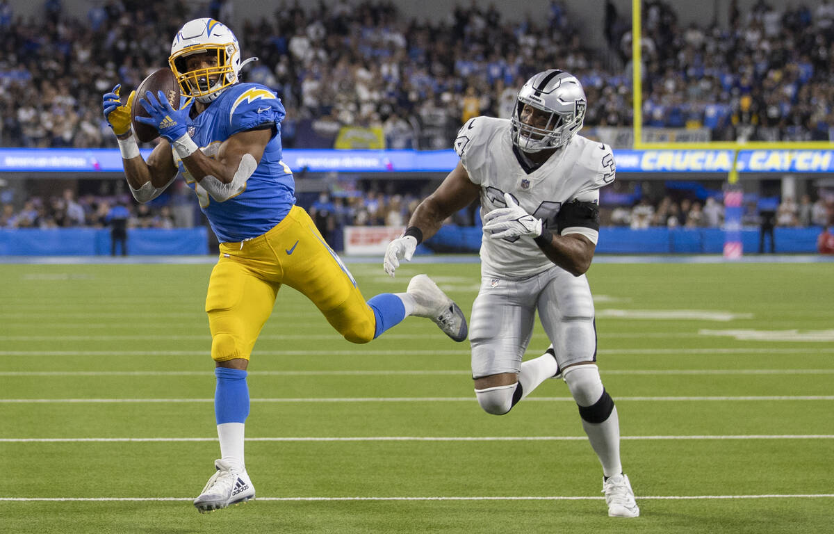 Los Angeles Chargers running back Austin Ekeler (30) makes a diving touchdown catch and run pas ...