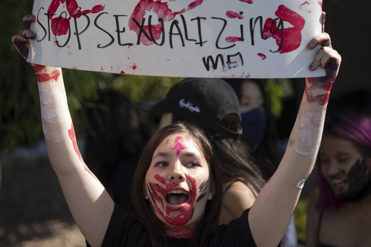 Freshman Lily Reynolds protests outside Coronado High School alongside about 100 fellow student ...