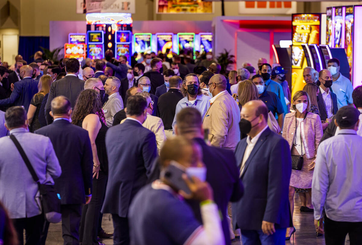 Attendees make their way about the Expo Hall on day 2 of the Global Gaming Expo 2021 conference ...