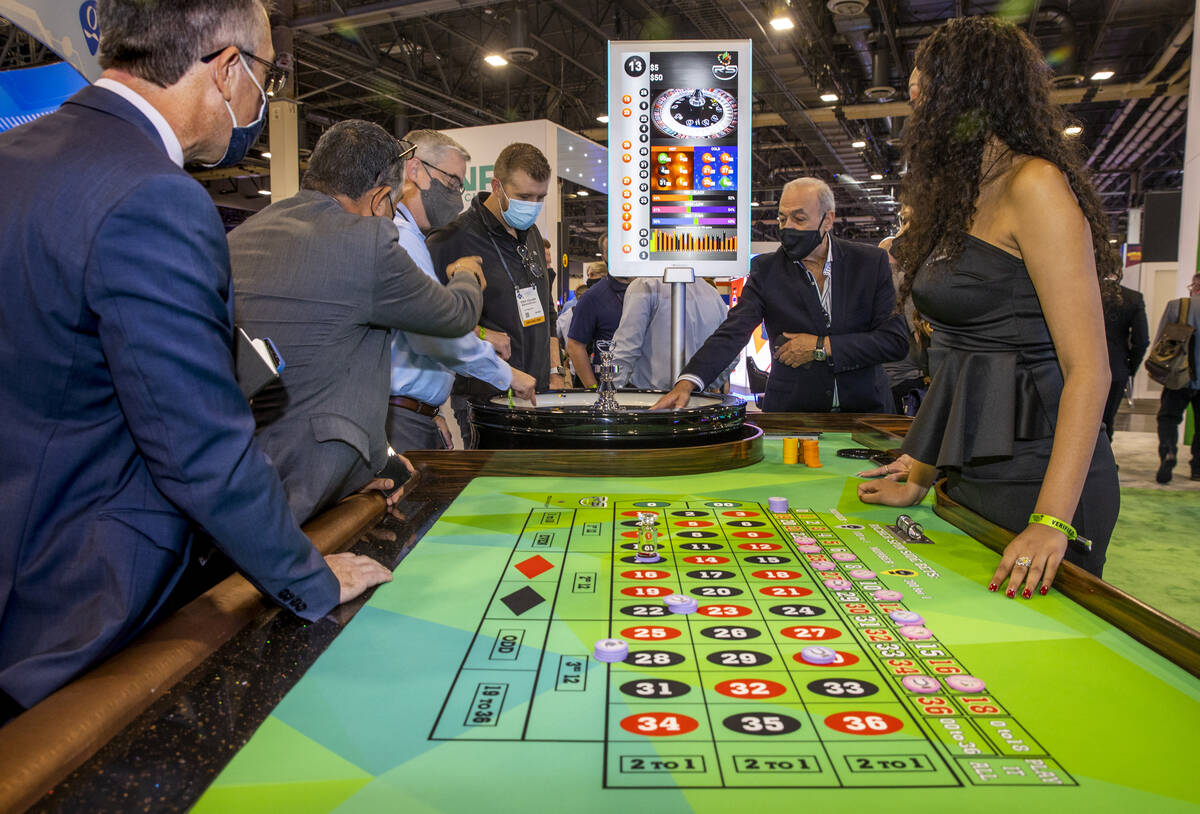 Attendees play a TCSJOHNHUXLEY Roulette wheel during day 2 of the Global Gaming Expo 2021 confe ...