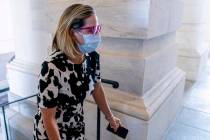 Sen. Kyrsten Sinema, D-Ariz., arrives at the U.S. Capitol for votes, Wednesday, Sept. 29, 2021, ...