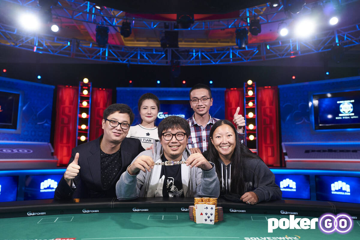 Long Ma with his supporters after winning the $500 buy-in The Reunion No-limit Hold'em at the W ...