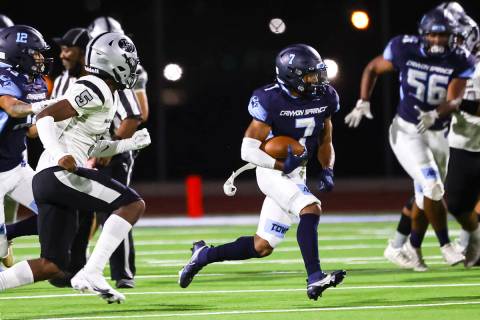 Canyon Springs running back Kenneth Jacobs (7) runs the ball against Palo Verde during the firs ...