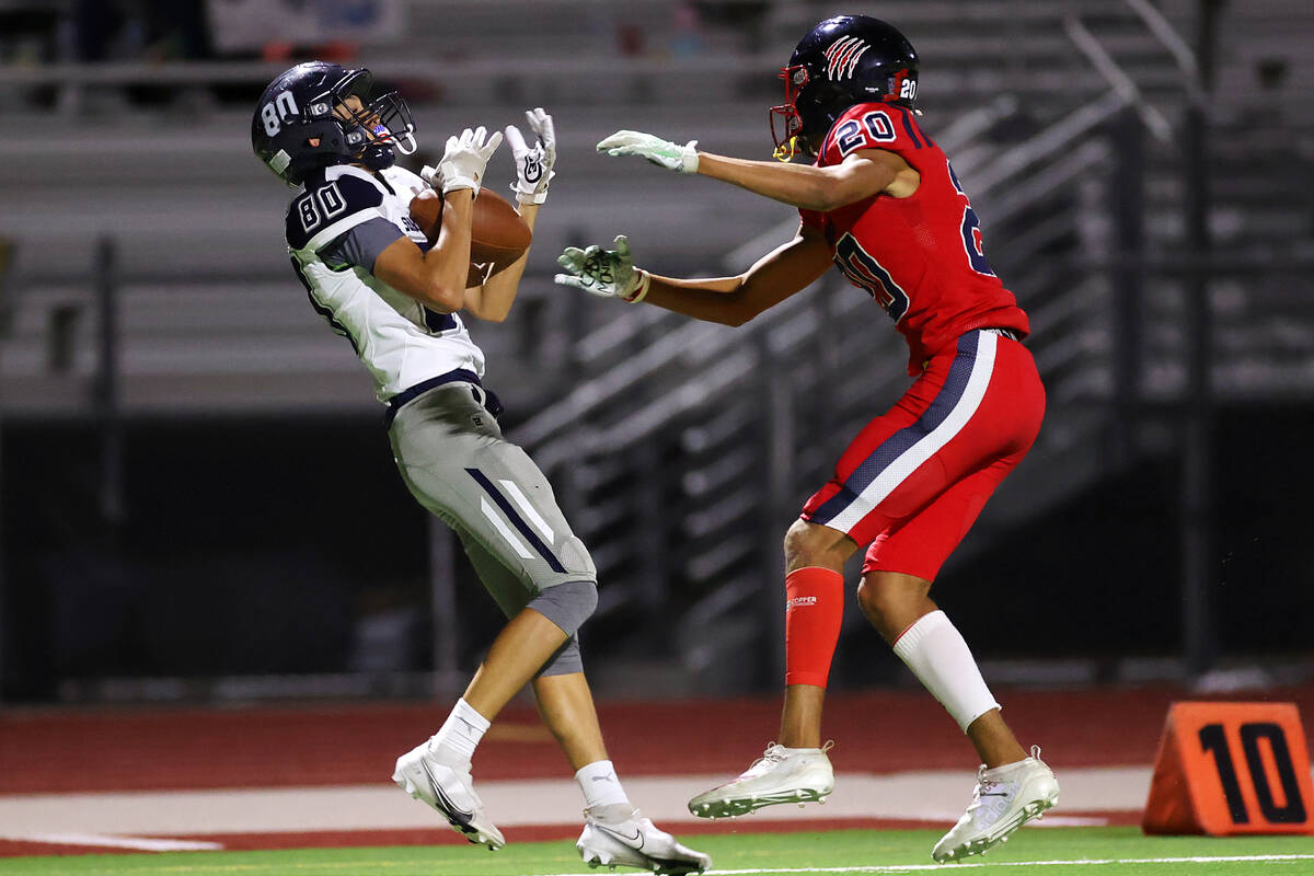 Shadow Ridge's Caleb Fisher (80) makes a catch under pressure from Coronado's Preston McQueen ( ...