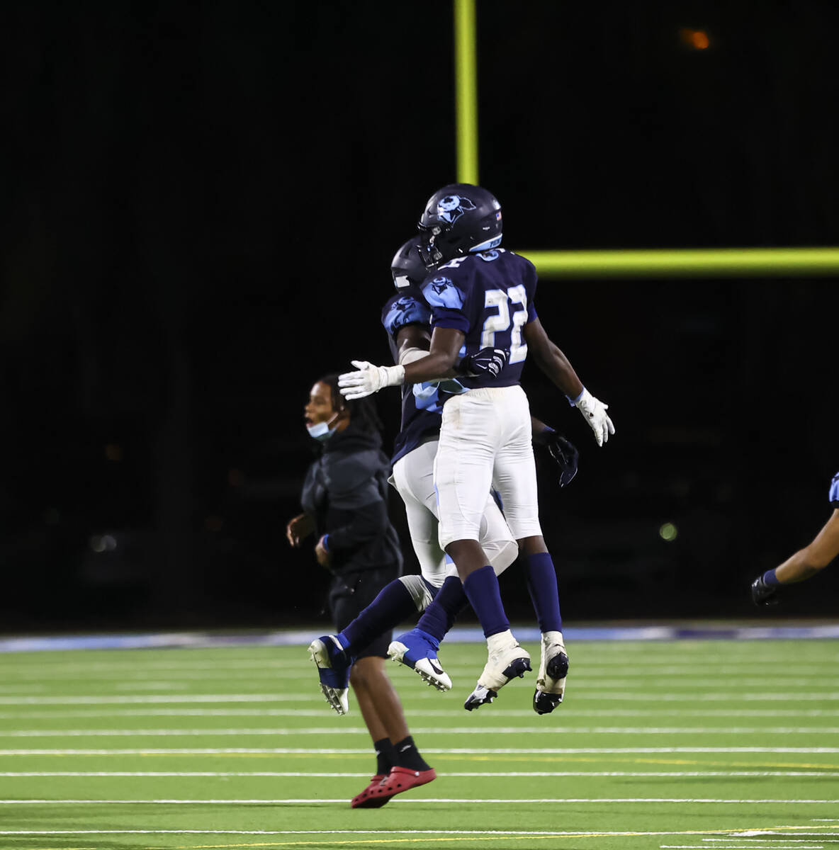 Canyon Springs' Laquari Dillon, left, and Omarion Ireland (22) celebrate the teamÕs victor ...