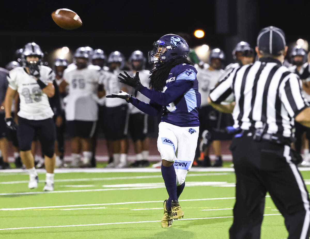 Canyon Springs' Dionn Whittaker (3) reaches out for a reception before scoring a touchdown on t ...