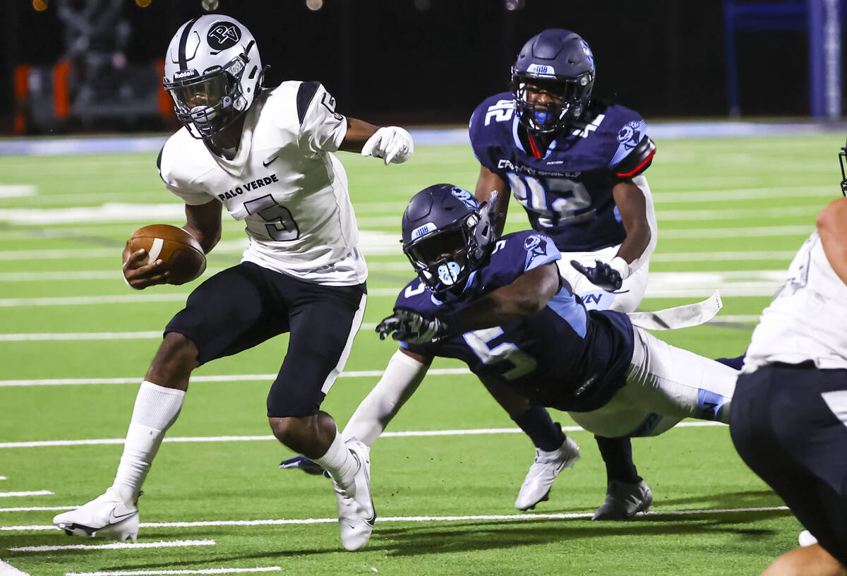 Palo Verde's Edward Rhambo (5) is forced out of bounds by Canyon Springs' Laquari Dillon (5) du ...