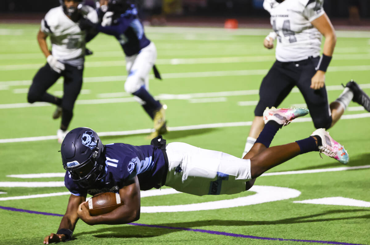 Canyon Springs' Nyic'quavayion Willis (11) gets tripped up by Palo Verde during the first half ...