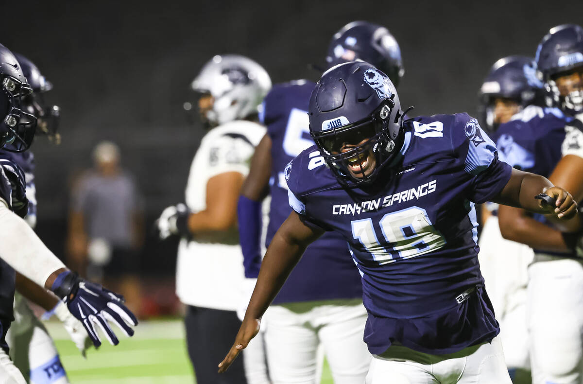Canyon Springs' Ezekiel Lakes (18) reacts after a play during the first half of a football game ...
