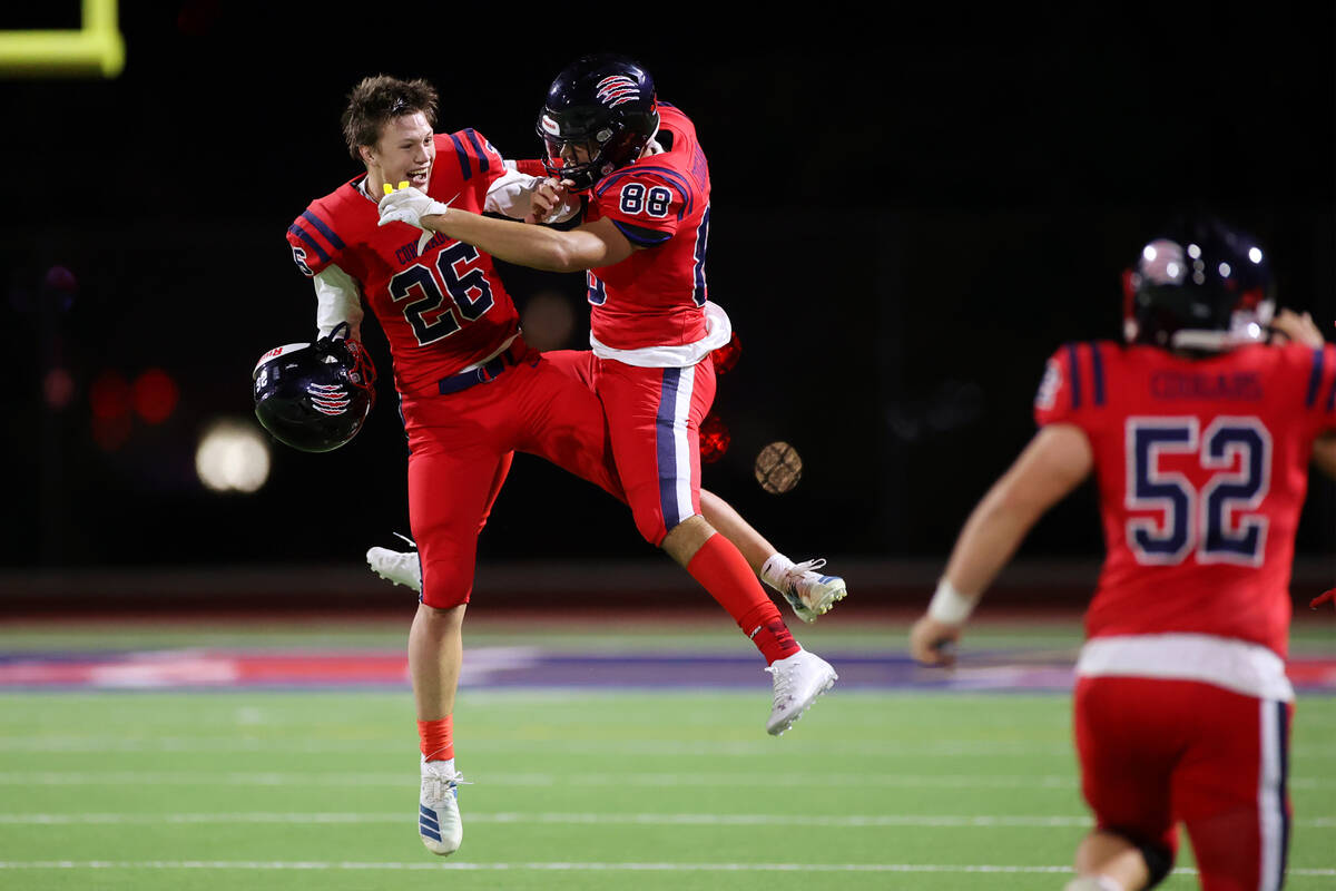 Coronado's Logan Chaney (26) and Michael Floyde (88) celebrate after their team recovered a fum ...