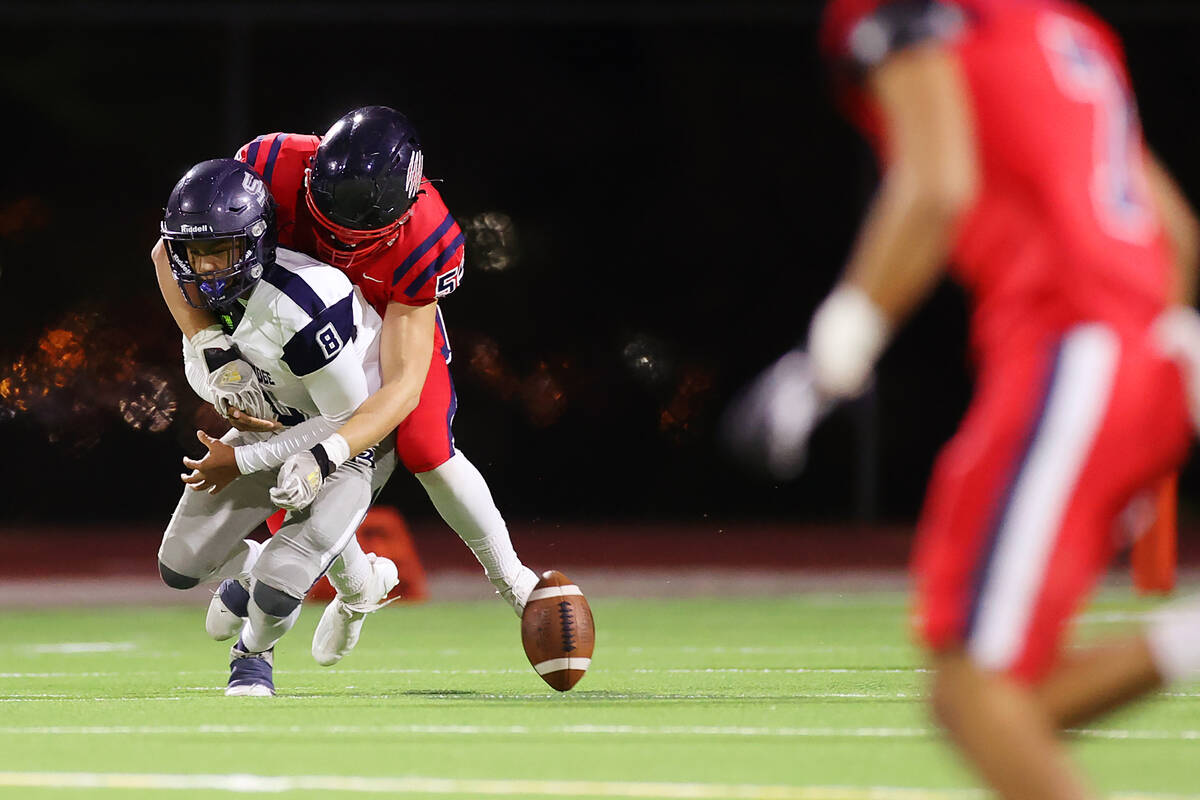 Coronado's Conall Mosteller (55) forces a fumble while sacking Shadow Ridge's Coen Coloma (8) i ...