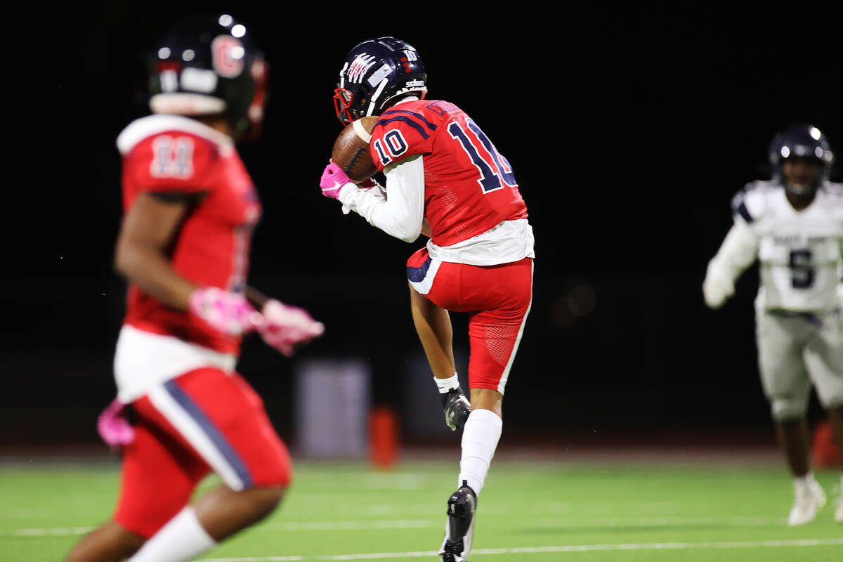 Coronado's Jaylen Garrison (10) makes a catch before running the ball for a touchdown against S ...