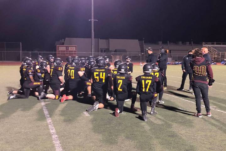 Tom Rysinski/Pahrump Valley Times Pahrump Valley High School football players listen to their c ...