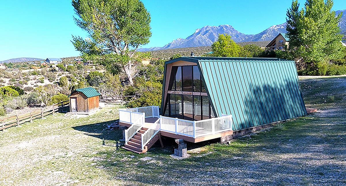 This off-the-grid cabin on a 1.36-acre lot has listed for $525,000. It is one of 200 lots in th ...