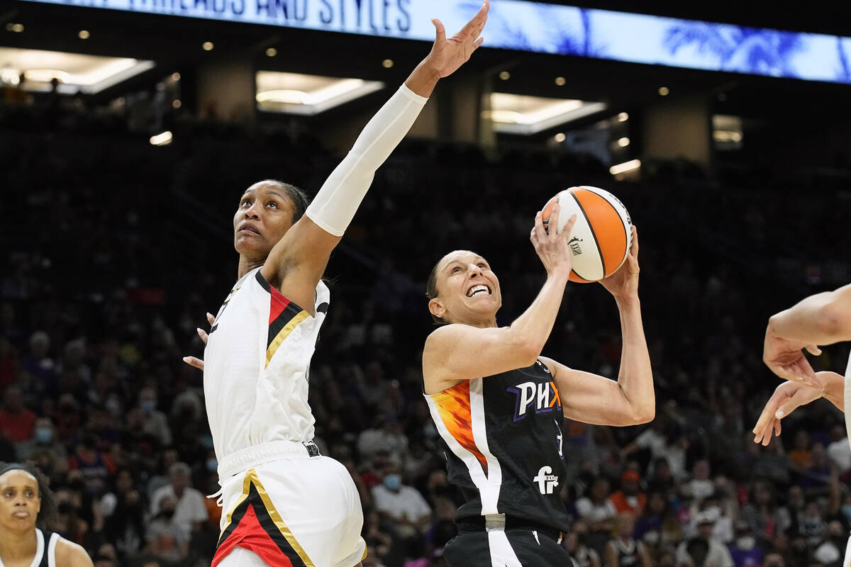 Phoenix Mercury guard Diana Taurasi (3) drives on Las Vegas Aces forward A'ja Wilson (22) durin ...
