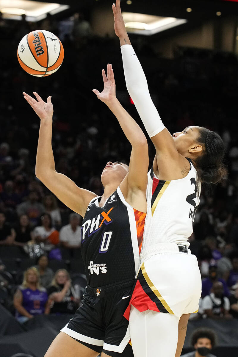 Las Vegas Aces forward A'ja Wilson (22) blocks a shot by Phoenix Mercury guard Kia Nurse during ...